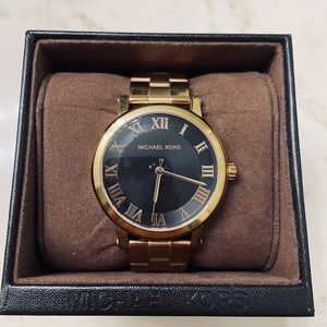 Gold and blqck Michael Kors watch